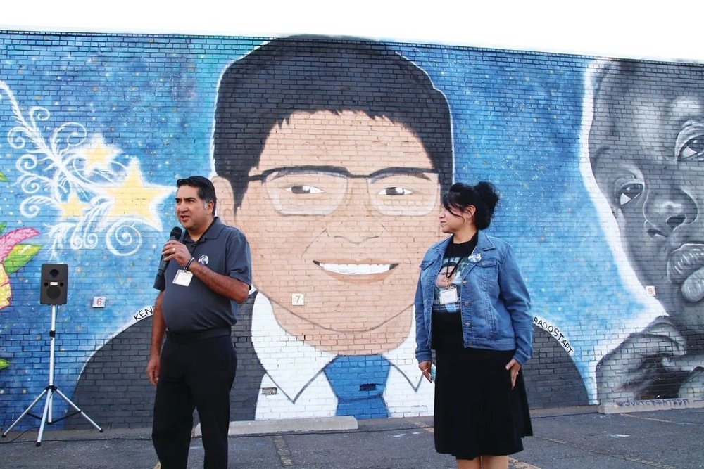John Castillo speaks at the unveiling of the Kendrick Castillo mural